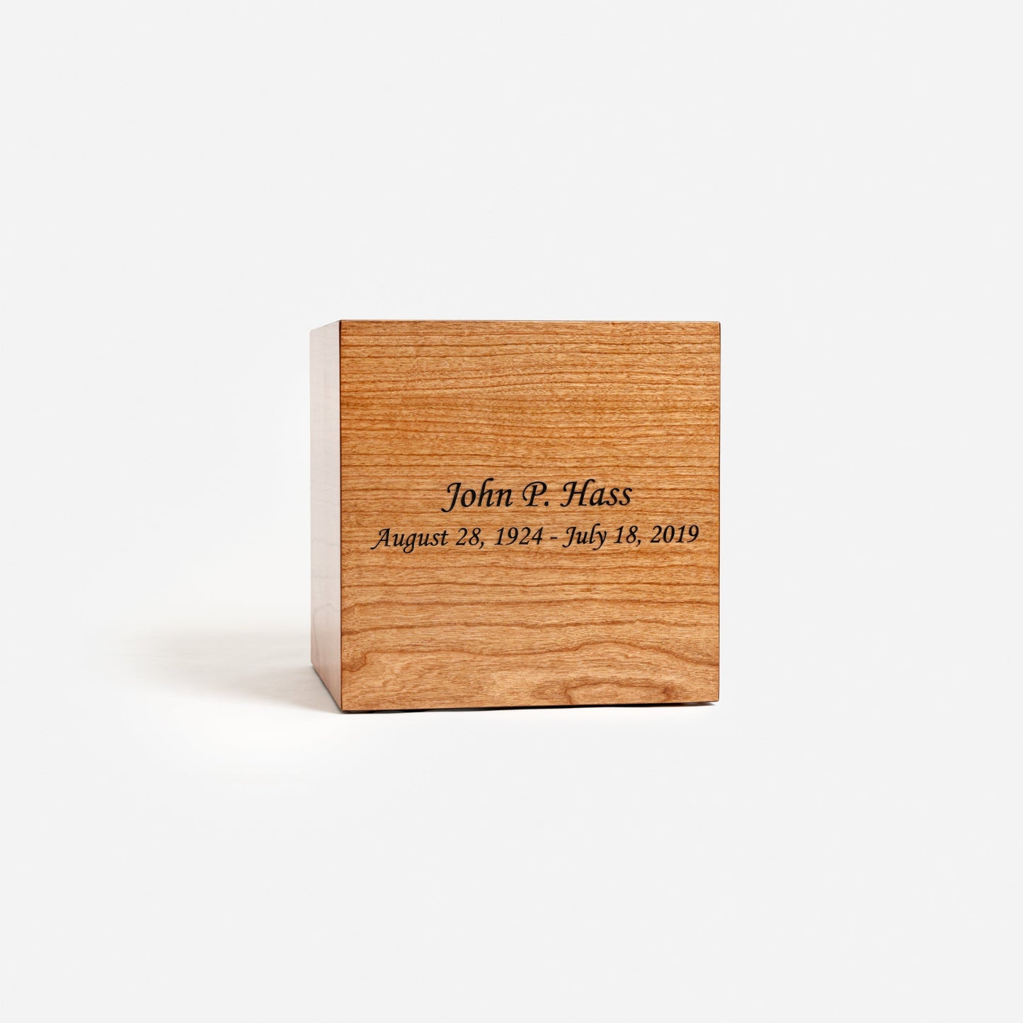Front view of handcrafted cherry wood cremation urn with smooth lacquer finish – adult size