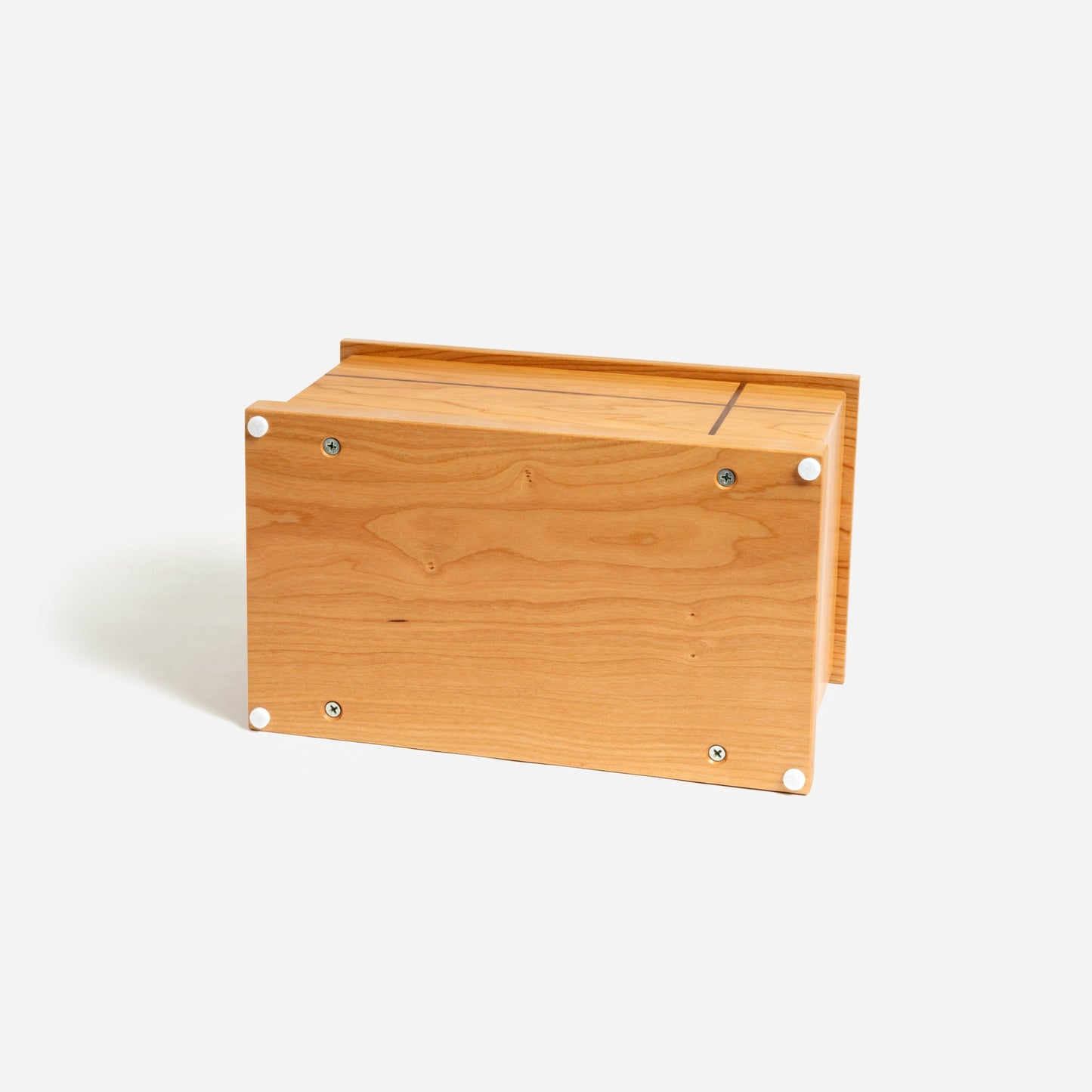 Bottom of cherry wood memorial urn showing screw-on panel for secure ash placement