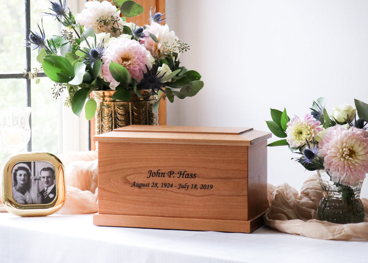 Cherry wood cremation urn displayed in home setting – traditional handcrafted urn for adult ashes