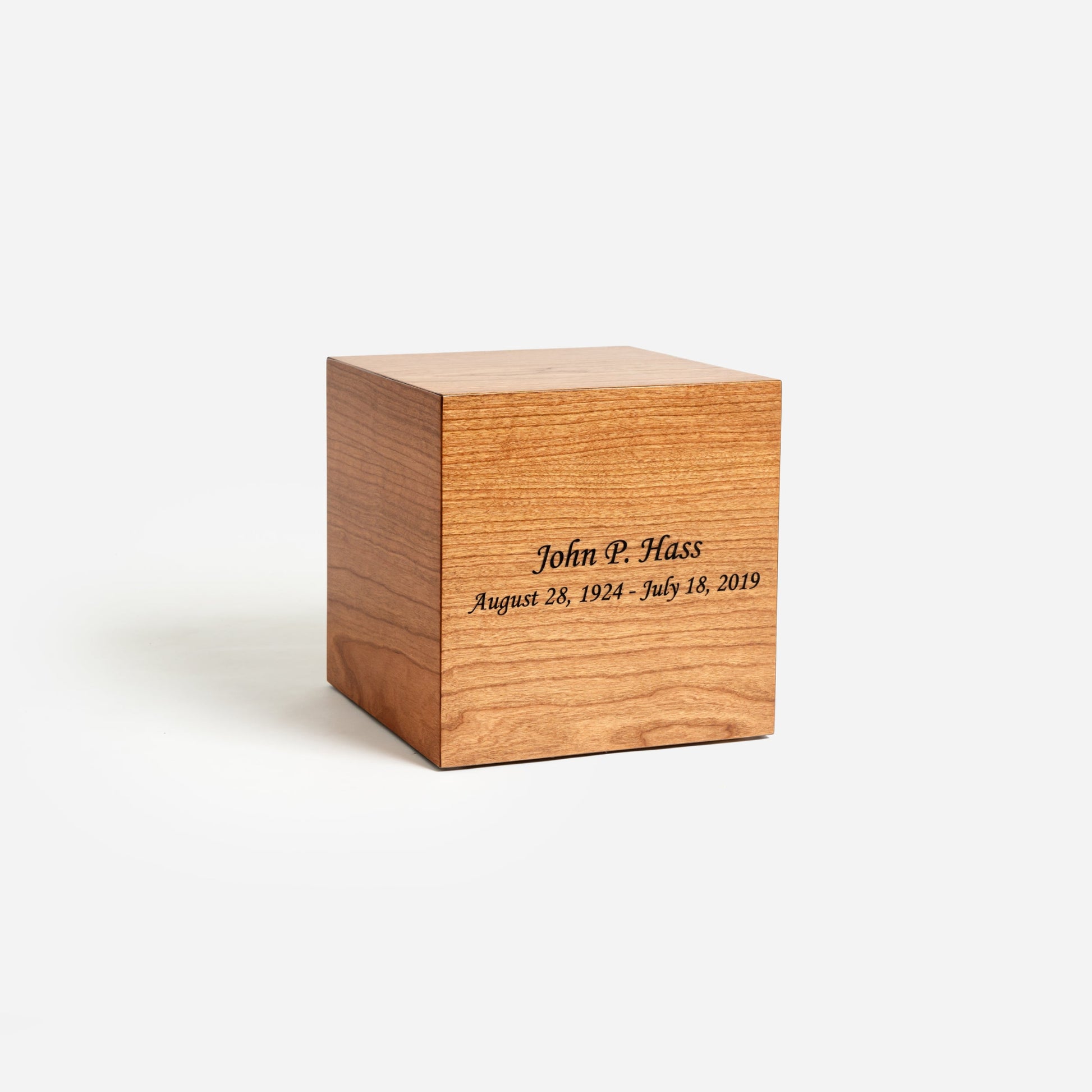 Angled front image of solid cherry urn showing clean lines and rich wood grain