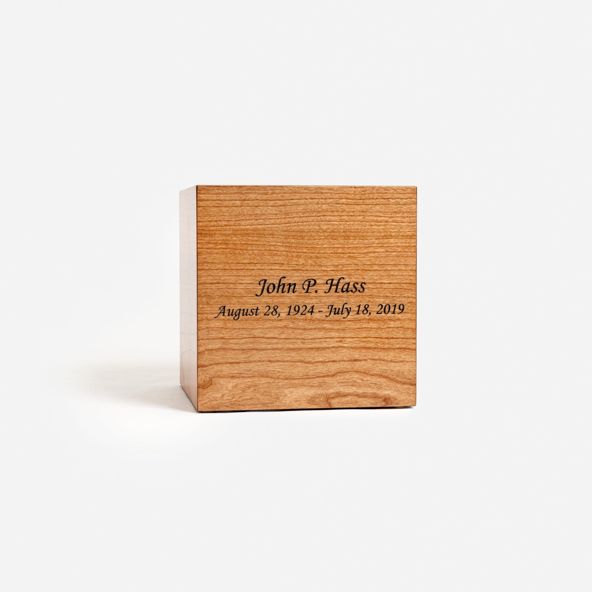 Front view of handcrafted cherry wood cremation urn with smooth lacquer finish – adult size