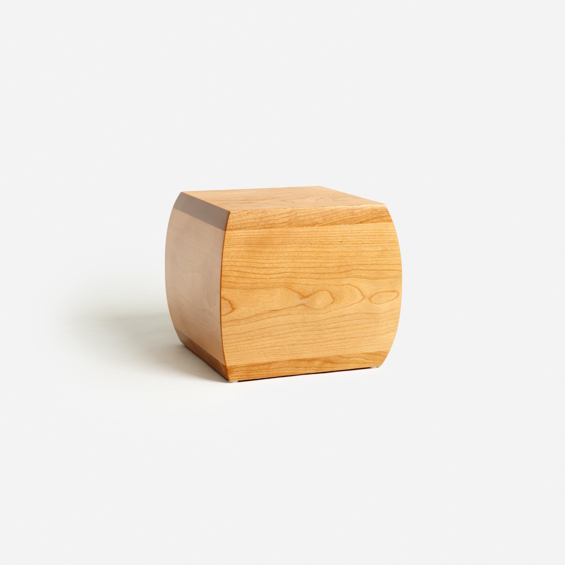 Side view of curved cherry urn – smooth curves with elegant wood grain