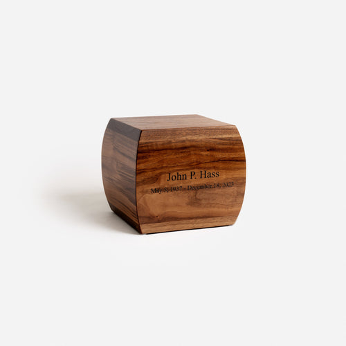 Angled view of curved walnut urn – soft curves and elegant craftsmanship