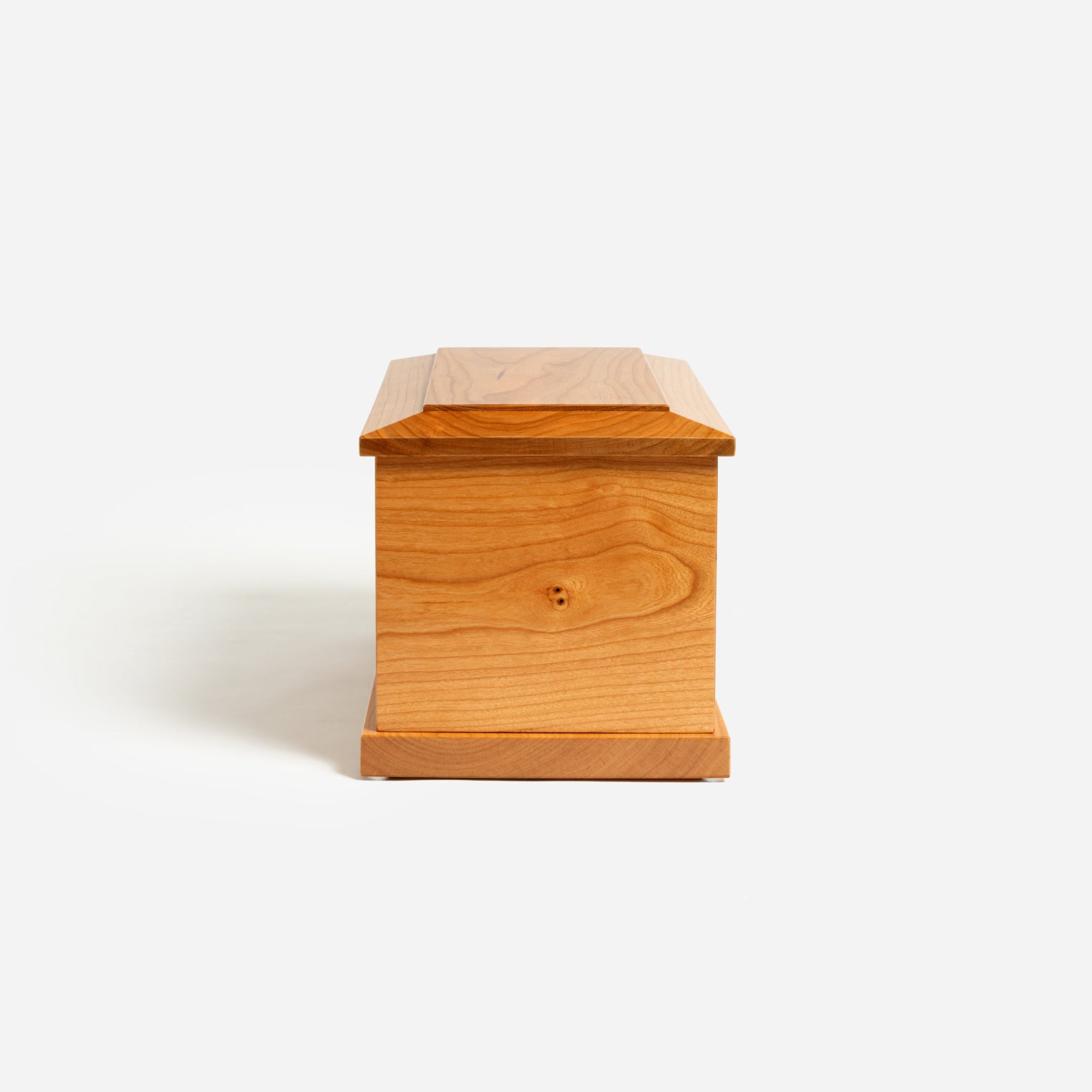 Side profile of cherry cremation urn – simple, elegant design with custom engraving option