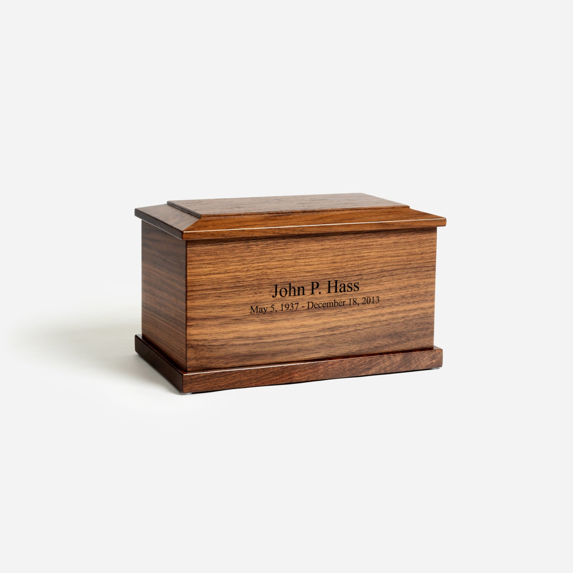 Angled front photo of walnut cremation urn showing rich grain and handcrafted detail