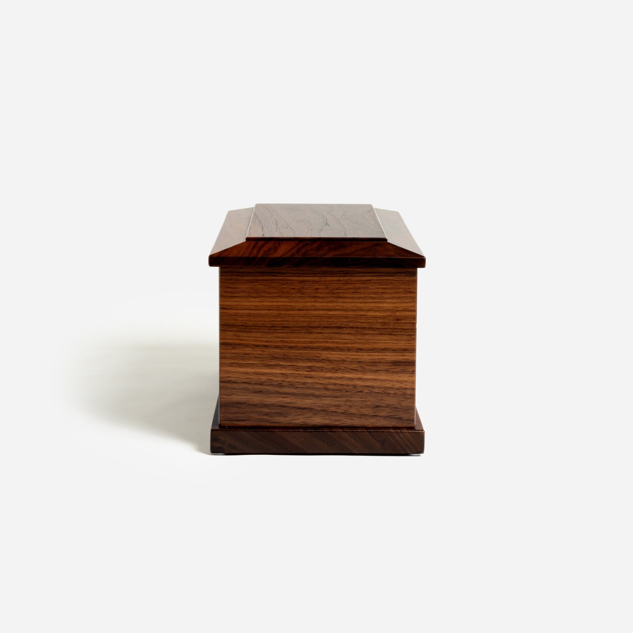 Side view of rectangular walnut cremation urn – built in Milwaukee with care