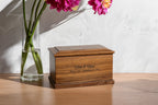 Handcrafted walnut wood urn for ashes displayed in home setting – elegant tribute for a loved one