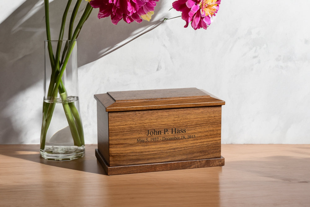 Handcrafted walnut wood urn for ashes displayed in home setting – elegant tribute for a loved one