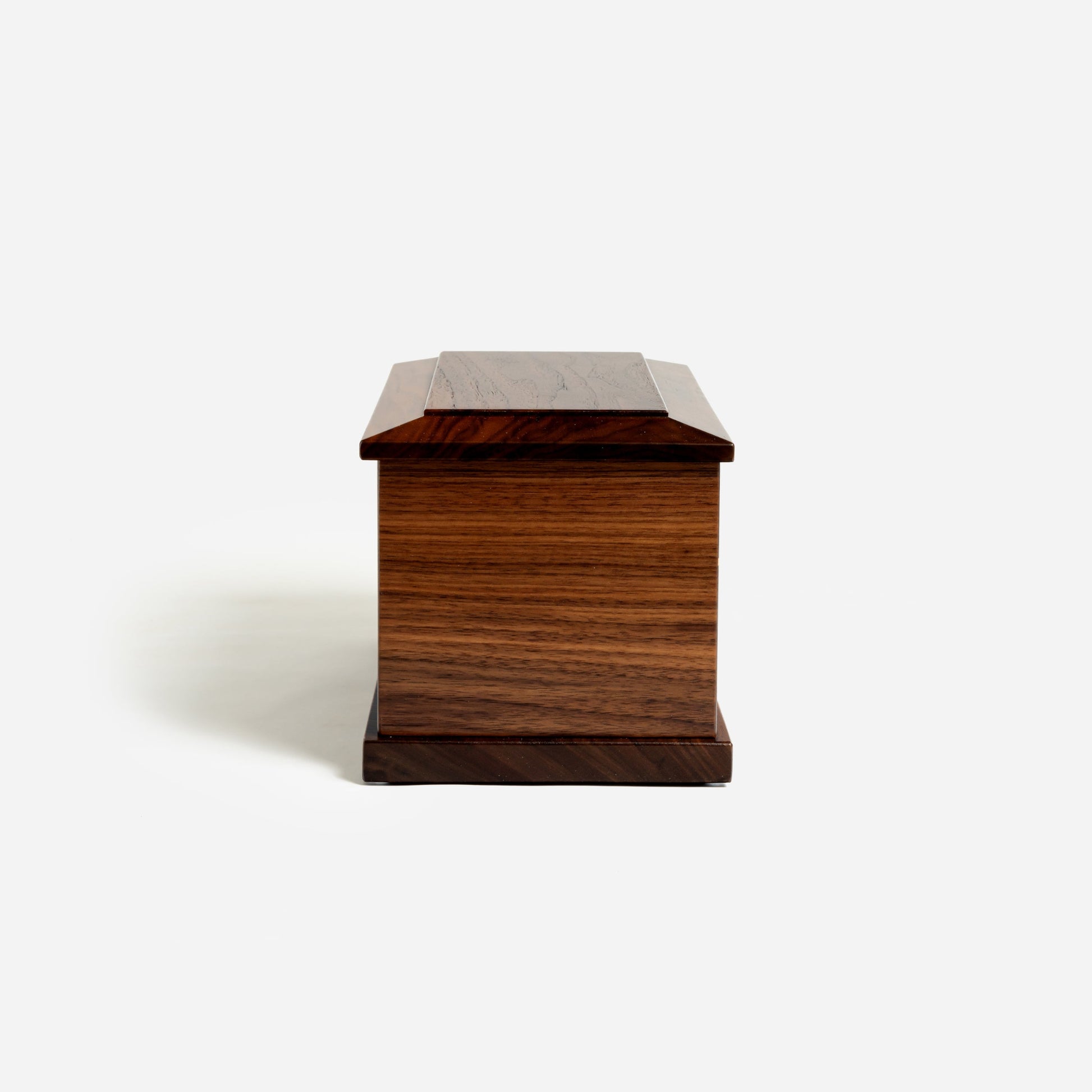 Side profile of handcrafted walnut wood urn – rectangular memorial urn for ashes
