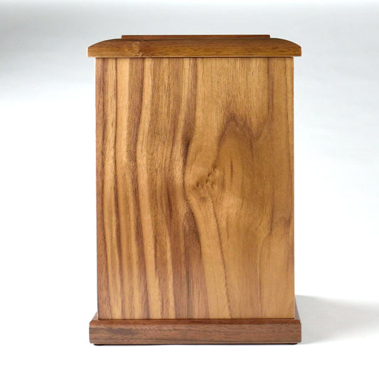 Front view of upright handcrafted walnut cremation urn for adult ashes – solid wood with lacquer finish
