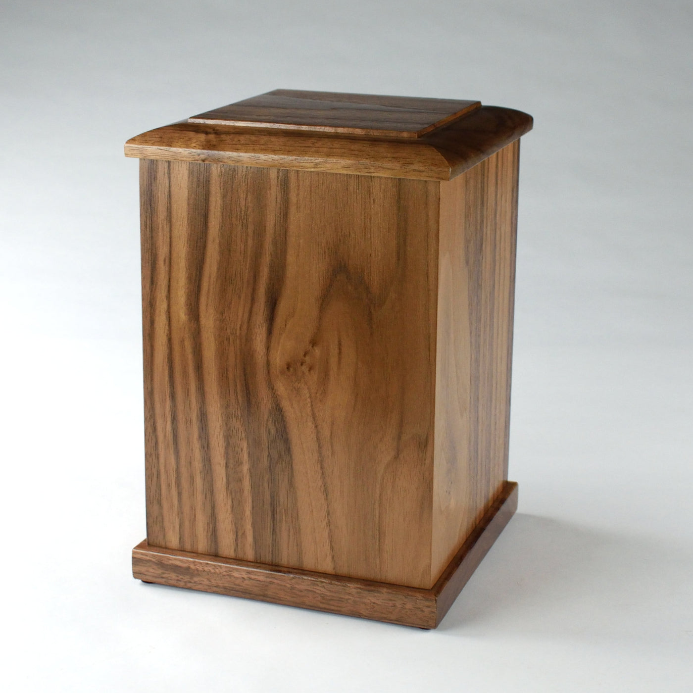 Side view of upright solid walnut memorial urn – handmade in Milwaukee with hand-rubbed finish