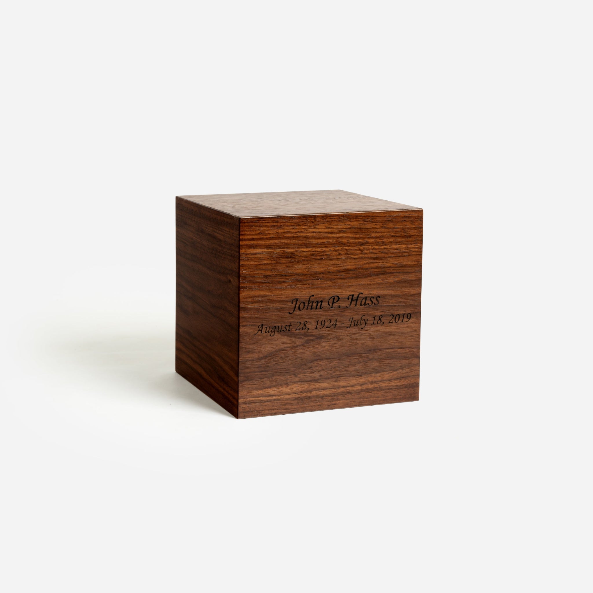 Angled front photo of square walnut urn showing bronze finish and clean craftsmanship